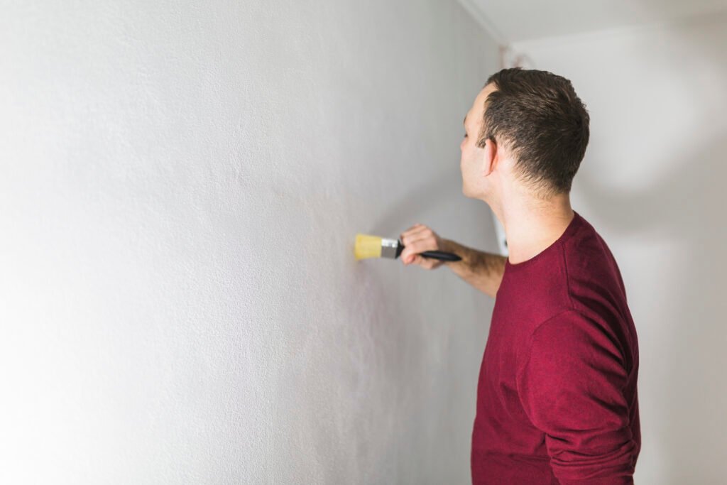 man-painting-wall